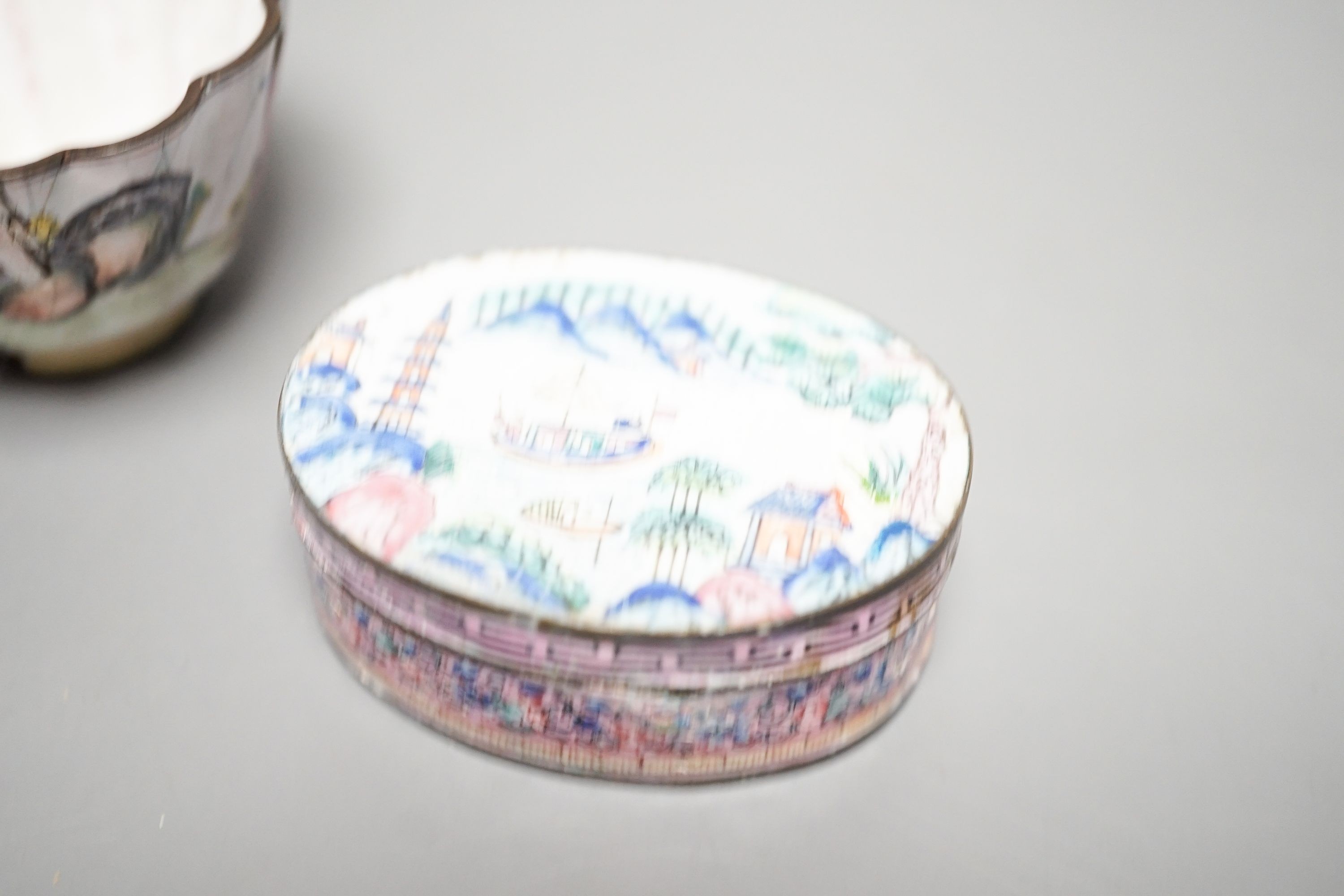 Two 18th century Chinese Canton enamel cups, and a 19th century Canton enamel oval snuff box, 5.8cm